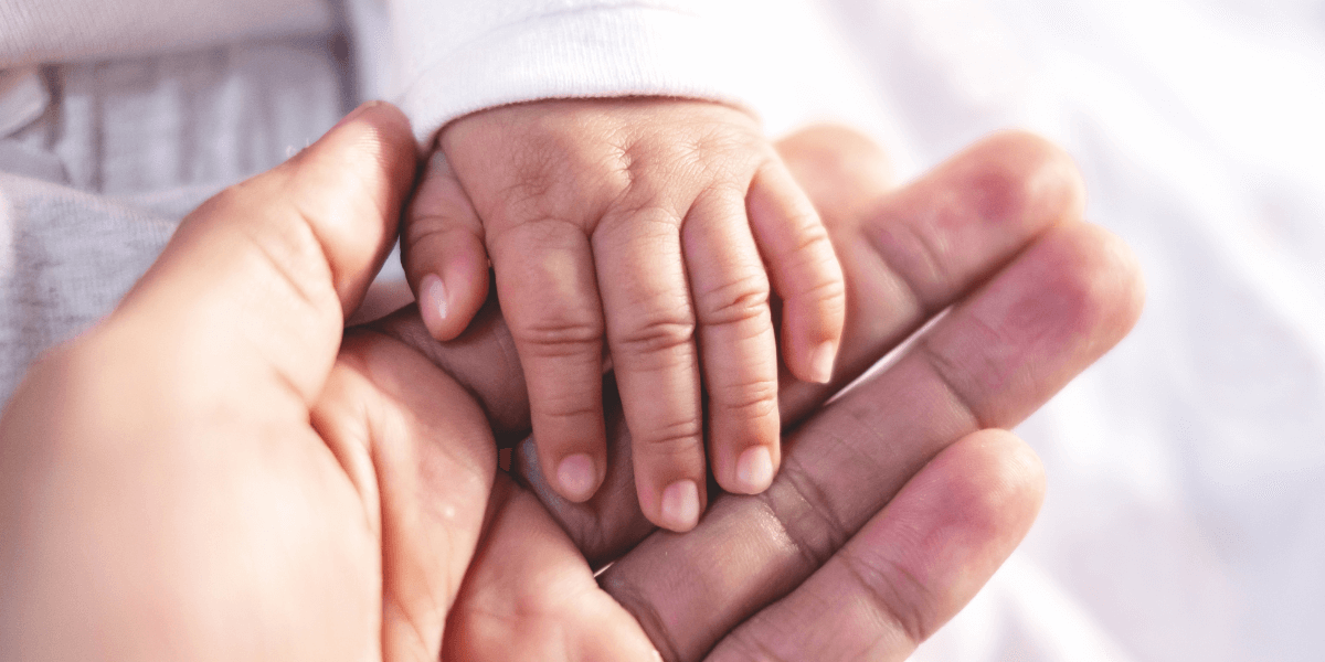 Parent holding baby's hand | Erb’s Palsy | Vinkler Law Offices