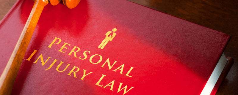 Book on desk with gavel that says "Personal Injury Law" | personal injury cases | Vinkler Law Offices, LTD.